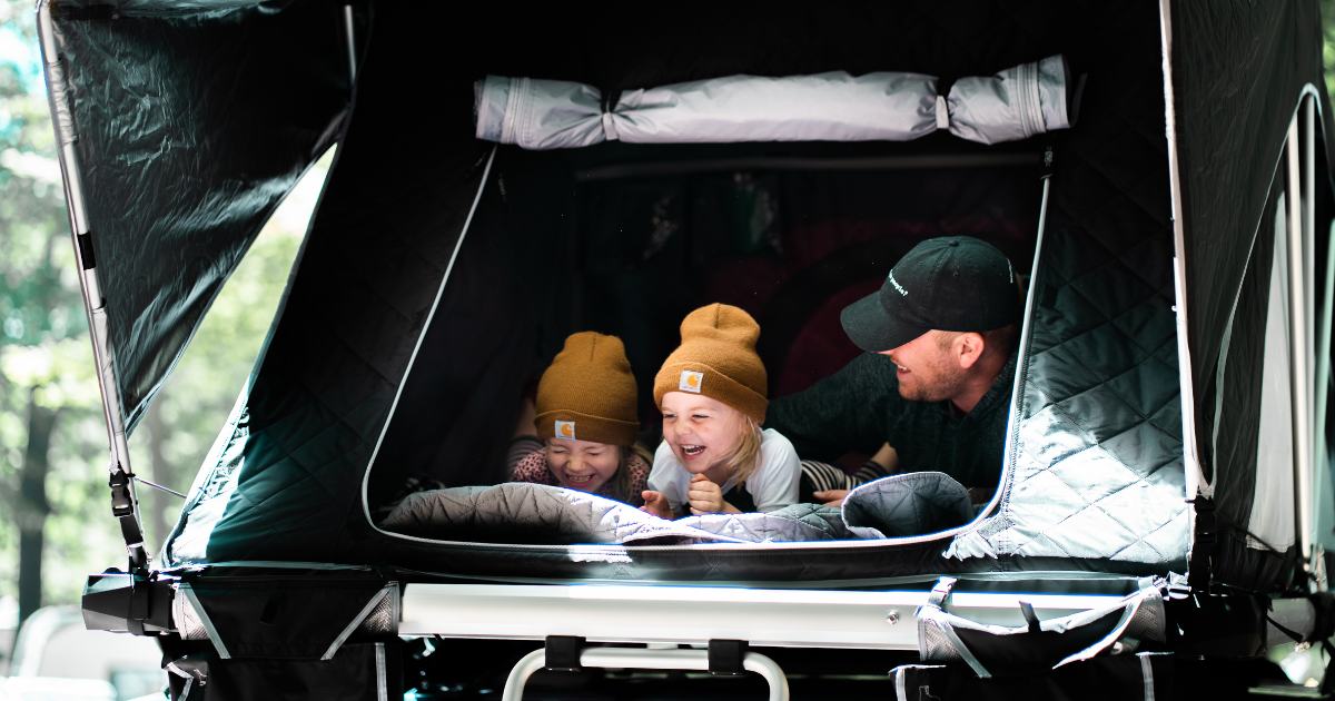 Father with children in a tent