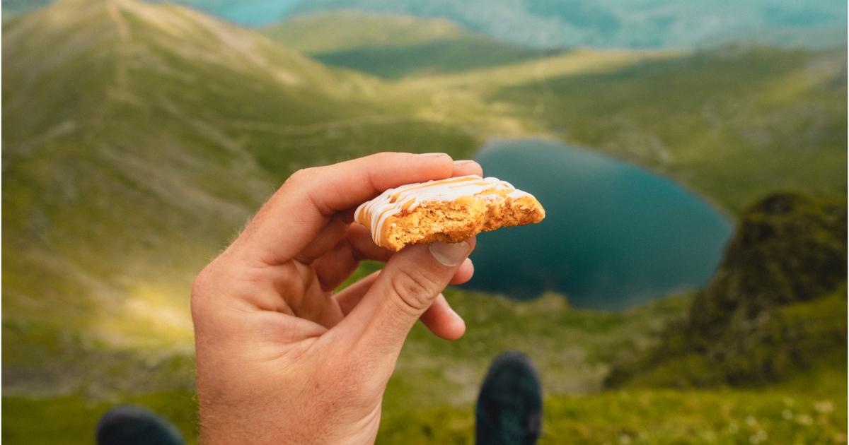 Traveler eating a tasty snack on a road trip