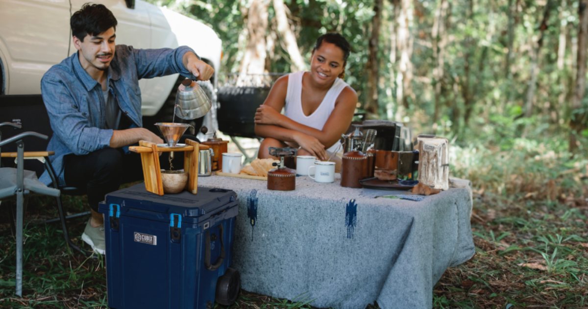 Two people camping with a Cubix Outdoors cooler