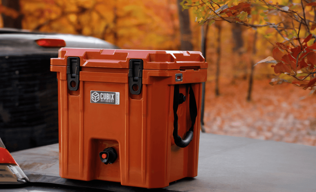 A 5-gallon Cubix beverage dispenser placed on a truck bed