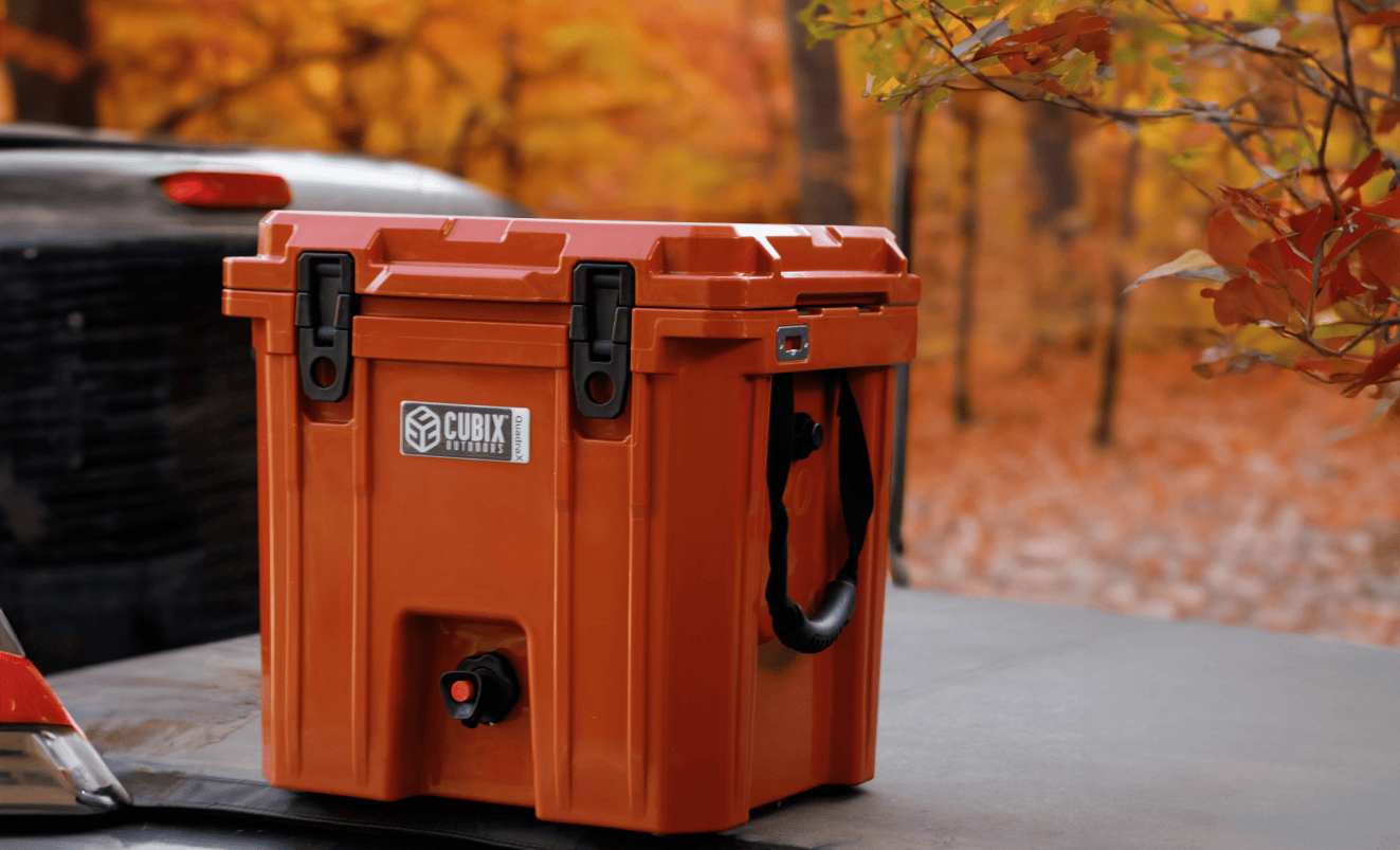 A 5-gallon Cubix beverage dispenser placed on a truck bed