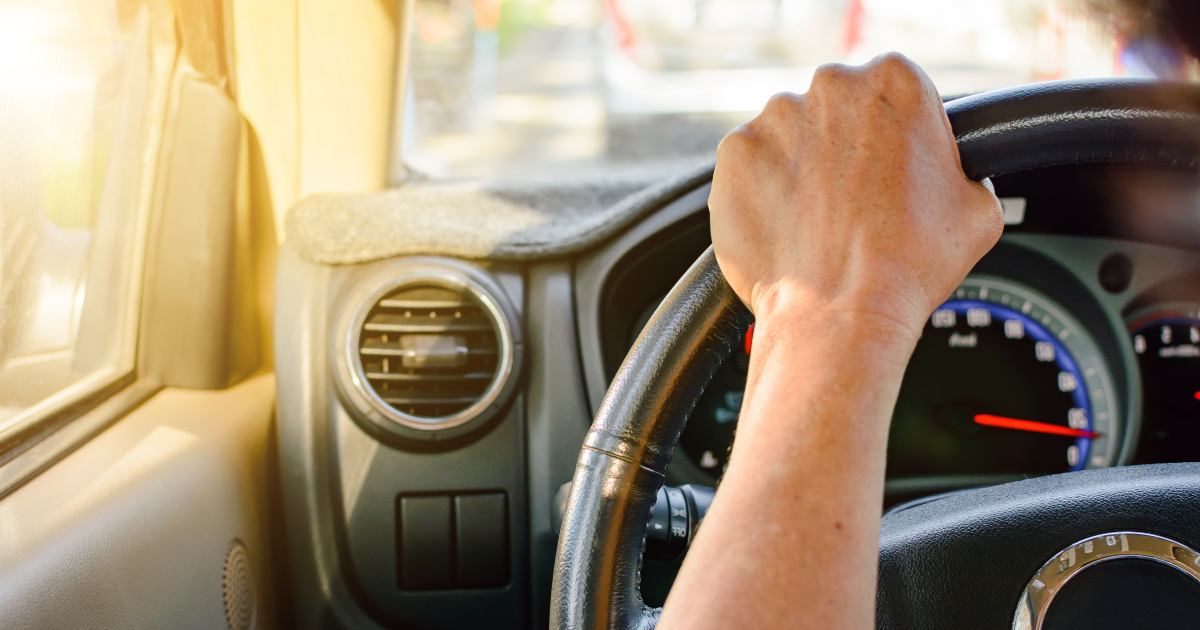 person driving on a road trip